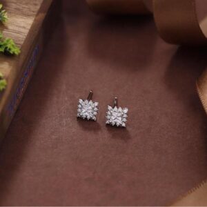 Classic Sterling Silver studs, Enhanced with Shimmering Zirconias and Sophistication.