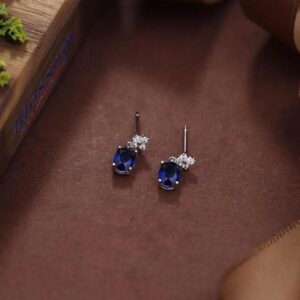 Stylish Sterling Silver Stud Earrings, Enhanced by Radiant Cubic Zirconia and Modern Flair